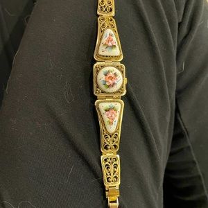 Vintage Russian Yanka watch with floral print on porcelain glass.